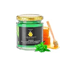Le miel d'acacia premium Caravella aromatisé à la menthe est un délice gastronomique qui réunit le meilleur des deux mondes : une douceur florale légère et une menthe croquante et rafraîchissante. C'est un miel sophistiqué et polyvalent qui transform...