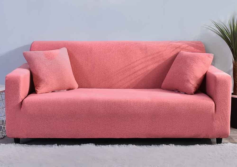 Housse de canapé extensible rose : stop aux plis grâce à l'élastique