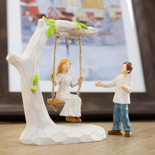 Statue de couple sur balançoire pour sublimer une table de chambre - 7