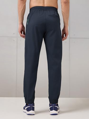 Image of TECHNOSPORT Men's Regular Fit Joggers with Zip Pockets, TS Flexi Quick Dry Stretchable Lightweight Track Pants for Gym Running and Casual Wear