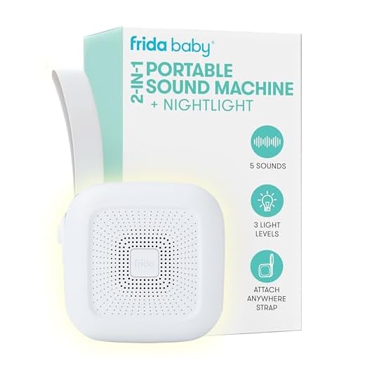 Frida Baby 2-in-1 Portable Sound Machine for Baby + Nightlight | White Noise Sound Machine for Baby with 5 Soothing Sounds & 3 Nightlight Modes | Travel Sound Machine Attaches to Strollers, Car Seats