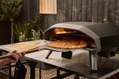 Image of ooni 14 inch Signature Perforated Pizza Peel - Anodised Aluminum Metal Pizza Peel 14 Inch With Long Walnut Wood Handle, Pizza Spatula Paddle, Pizza Oven Accessories, Pizza Tools