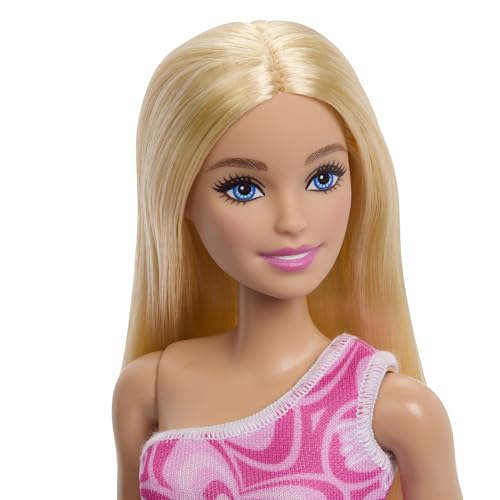 Image of Barbie Dolls in Barbiecore-Inspired Outfits with Pink & Purple Heels, Variety of Pink Patterned Dresses and Hair Colors