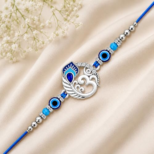 Image of Riddhika Ventures Alluring Gold Plated Om and Pearl Rakhi with Roli Chawal & Greeting Card for Men (R1)
