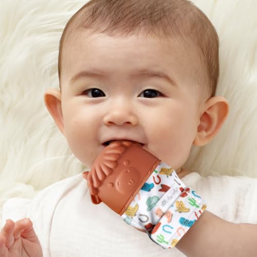 Image of Itzy Ritzy Silicone Teething Mitt - Soothing Infant Teething Mitten with Adjustable Strap, Crinkle Sound & Textured Silicone to Soothe Sore & Swollen Gums - for Ages 3 Months & Up (Cow)