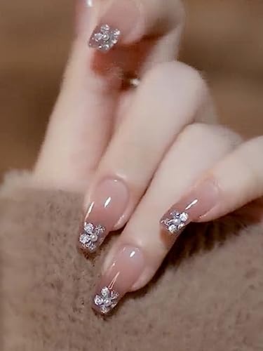 Image of Secret Lives fake artifical acrylic press on nails transparent & brown color false nails extension with silver glitter flower design & 3D white pearls design 24 pieces set with glue sheet stickers