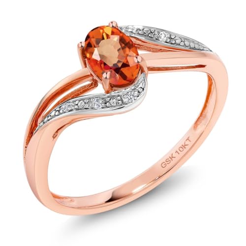 Gem Stone King 10K Rose Gold Orange Sapphire and White Diamond Engagement Bypass Ring For Women (0.59 Cttw, Oval 6X4MM, Available 5,6,7,8,9)