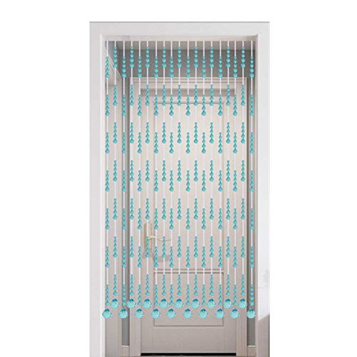 Rideaux de porte perlés pour structurer un studio sans cloisonner - 2
