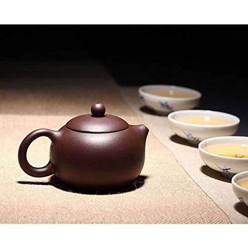 Tetera de cerámica marrón con filtro artesanal que evita hojas sueltas en tu té 7