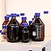 PATIKIL 8 Pack Reagent Media Storage Bottles, 50ml Borosilicate Glass Graduated Round Bottles with GL32 Blue Screw Cap for Lab Water Reagent Liquids, Clear