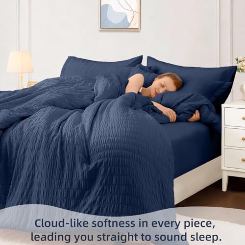 Condition photo showing New/Like New for fuanna queen comforter set 7 pieces, luxury seersucker bed in a bag queen size for all seasons, soft bedding set with comforter, flat sheet, fitted sheet, pillowcases & shams for bedroom, navy blue