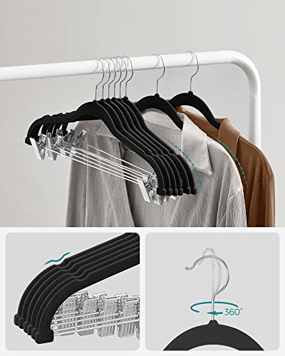 Image of SONGMICS Trouser Hangers, Set of 12 Velvet Hangers with Adjustable Clips, 42.5 cm Long, Non-Slip, Space-Saving, for Skirts, Coats, Dresses, Black CRF12B | Space Saving Hangers for Skirts and Trousers, Non-Slip, Adjustable Clips, Ink Black, BREANNA Collection CRF12B