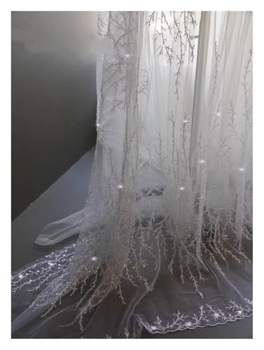 Tissu maille avec broderie perlée blanc pour customiser une robe de soirée