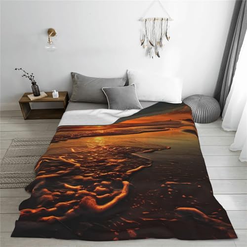 Couverture flanelle orange lever de soleil, un cocon de douceur chaude