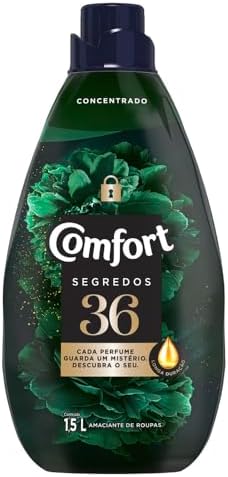 Garrafa de Amaciante Comfort Concentrado Segredos 36 de 1,5L com fundo floral escuro.