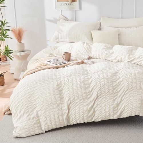 Image of HYMOKEGE Ivory Oversized King Comforter Set Seersucker 7 Pieces, All Season Luxury Bed in a Bag for Bedroom, Bedding Set with Comforter, Sheets, Pillowcases & Shams