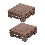 Élégance artisanale : ce présentoir en bois pour vases présente des détails finement sculptés à la main, soulignant avec subtilité le savoir-faire oriental et créant un socle décoratif raffiné pour théières et vases traditionnels