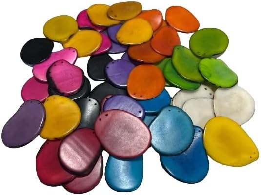 Tagua nut Thin Slices/Beads / 45 Chips in 9 Colors. Jewelry Making. Handmade Beads from Colombia. Size: 4 x 3 cm. Approx. Top Drilled, 2 Holes. 45 Pieces in 9 Colors. Woodwork. Fair Trade