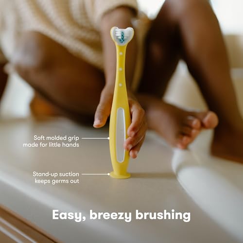 Image of Frida Baby Triple-Angle Toothhugger Training Toddler Toothbrush | Toddler Toothbrush 2 Years and Up, Cleans All Sides at Once | Yellow