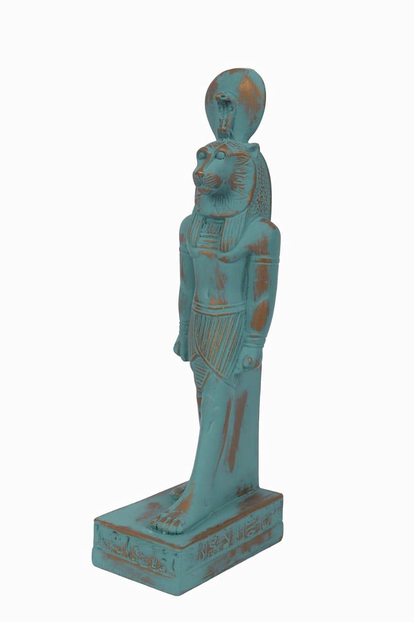 statue of Sekhmet Goddess of healing and War painted with a green color and gold antique