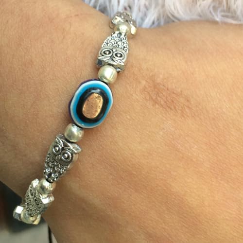 Image of Touchstone New Indian Bollywood Handcrafted Blue Evil Eye Engraved Owl Motif Metallic Beads Fabulous Style Designer Jewelry Adjustable Thread Bracelet in Oxidized Silver Tone for Women