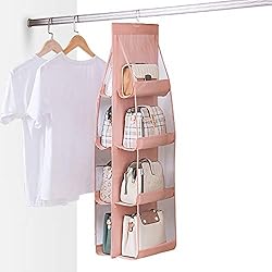 pink and clear 8-slot hanging purse storage on closet rod with white shirt.