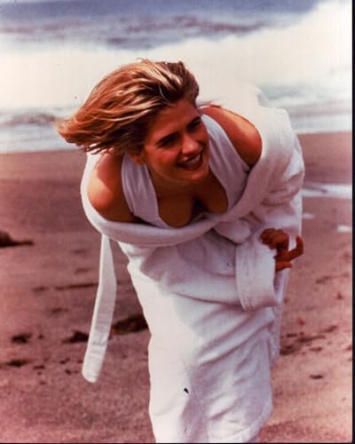 Posterazzi Kristy Swanson Leaning Forward On Beach In White Swimsuit And Robe Photo Print (8 x 10) - Item MVM72116