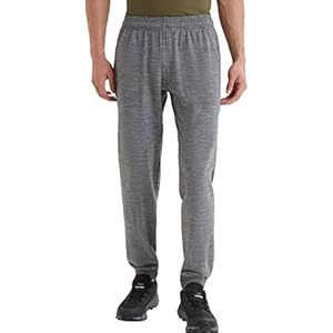 Bottom half of a man wearing classic gray sweatpants.