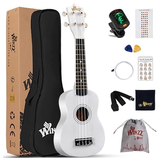Winzz Ukelele Soprano Starter Kit para Principiante. Incluye: Funda, Afinador, Cuerdas Extra, Correa Ajustable, Púas, Pegatinas de notas, Guía de Acordes y Paño de pulido. Color: Blanco