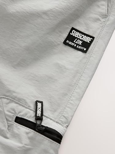 Pantalones cargo para niños con bolsillos con cremallera cómodos de NEXT en color verde militar 5