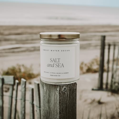 Image of Sweet Water Decor Salt and Sea Candle, 9oz Clear Jar, Coastal Beach Decor | Sea Salt, Musk & Amber Scented Soy Wax Candle, Gold Lid, 40+ Hour Burn Time, Poured in the USA, Summer Home Fragrance