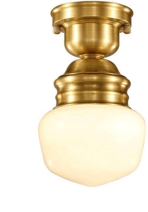 Lustre en cuivre design pour créer une ambiance chaleureuse dans l'entrée