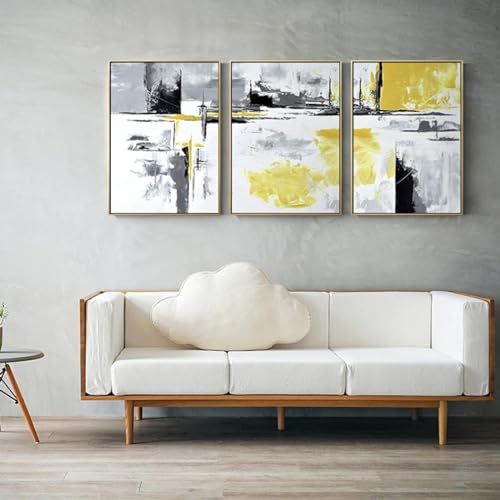 Toile abstraite jaune et noire pour sublimer le design d'un salon contemporain lumineux