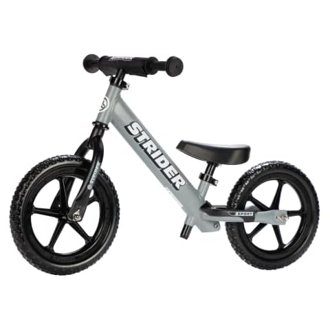 Strider 12” Sport Bike, Matte Gray - No Pedal Balance Bicycle for Kids 1 to 4 Years - Includes Safety Pad, Padded Seat, Mini Grips & Flat-Free Tires - Tool-Free Assembly & Adjustments Cover