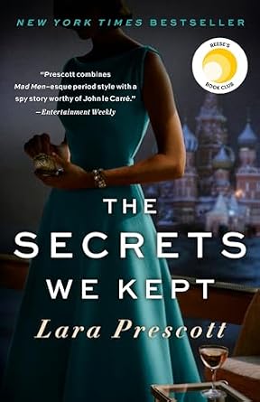 The Secrets We Kept by Lara Prescott, depicting a woman in a blue dress holding an item in her hands with a glass of alcohol placed on the table at her feet.