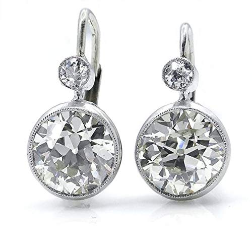 Aretes de boda con circón de color brillante que realzan el rostro femenino