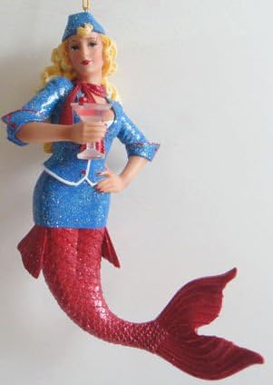 December Diamonds Regina -Sexy Pan Am 60's Stewardess Mermaid Ornament ...Long Blond Hair, Beautiful Blue Eyes, Red "Ruby"Buttons on her Glittered Blue Jacket.Regina is Long, Lean, & Buxom with a Plunging Neckline. She's Single & it's Cocktail Hour! Pink Martini in Hand. You Don't have a Fear of Flying...Do You?