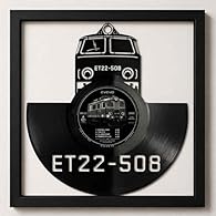 Wall decoration made of real vinyl record in frame 32 x 32 cm Inspired by rock music and legendary bands Inspired by rock music and music bands Stylish combination of retro and modern design Ideal for living room, studio or office