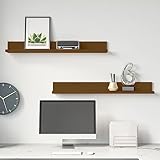 Décoration élégante et fonctionnelle, ces étagères offrent non seulement des solutions de rangement pratiques, mais elles servent également d'élément de design chic, vous permettant de personnaliser votre espace et de mettre en valeur vos pièces décoratives préférées avec leur finition moderne marron miel.