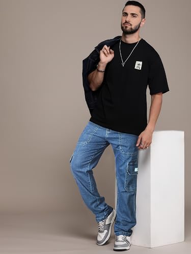 Image of RIG BONE Men's Relaxed Fit Cargo Jeans with Functional Pockets Comfortable High Rise Design Durable Denim Mid Wash Ideal for Casual Wear Travel Outdoor and Urban Adventures