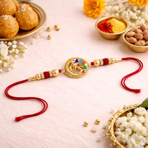 Image of JAIPUR ACE Designer Gold Plated Om Rakhi with Multicolor Stones - Premium Raksha Bandhan Thread for Brother, Elegant Ganesha Rakhi with Red String, Beads & Festive Traditional Finish (Golden Om rakhi)