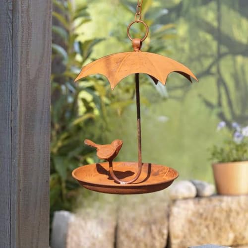 Mangeoire rustique pour oiseaux sur un porche fleuri en fer résistant aux intempéries