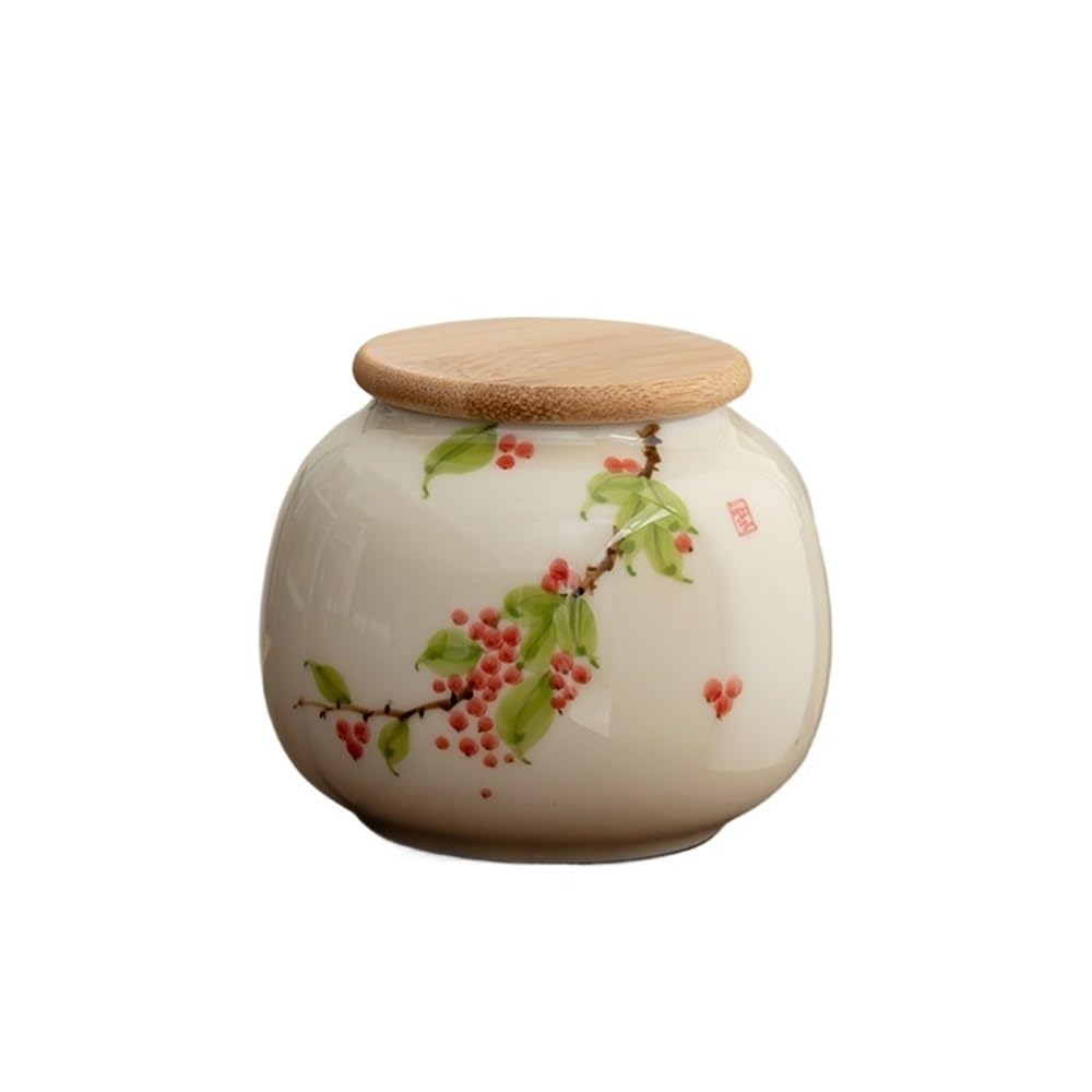 Lata de té portátil pequeña en color rojo con un elegante diseño pintado a mano