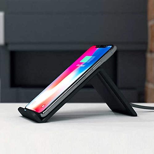 Smartphone charging on an Atomi Wireless Charging Stand from a side view