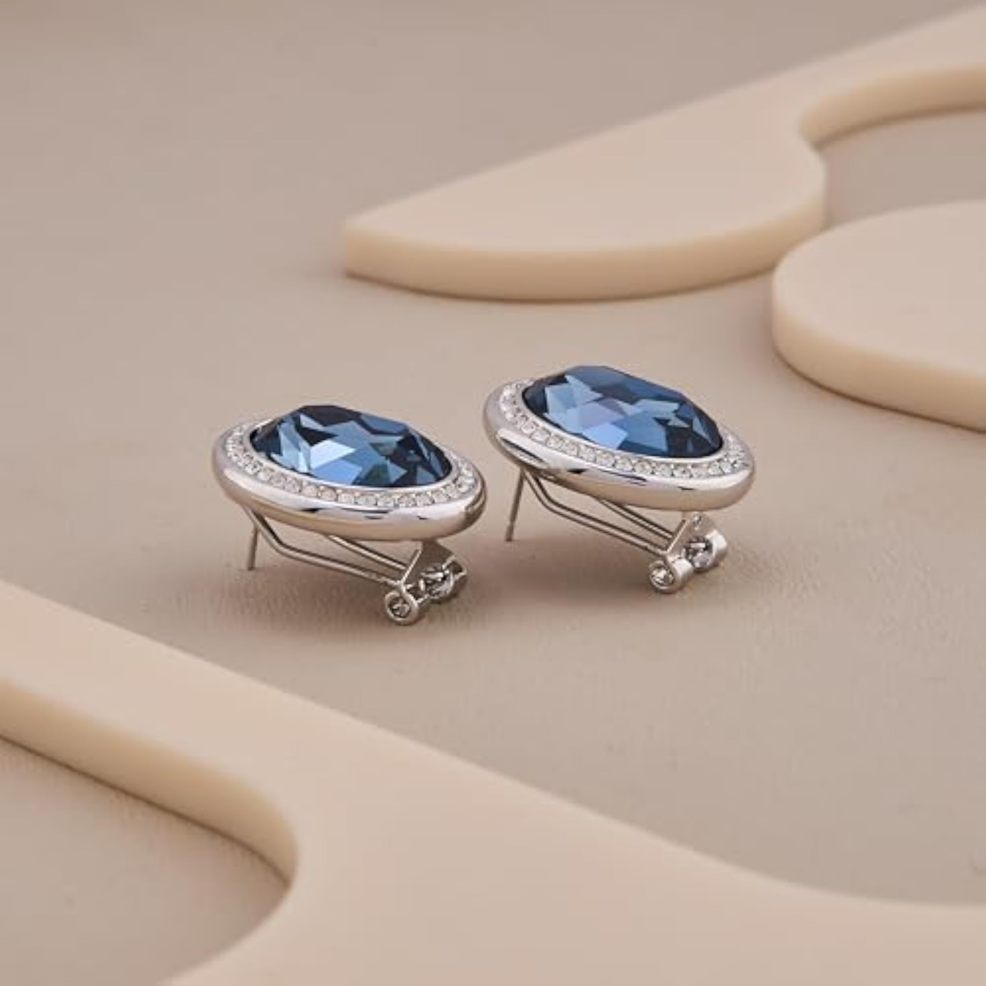 Women's Oval Blue Stone Stud Earrings with American Diamond Halo