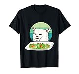 Angry women yelling at confused cat at dinner table meme T-Shirt