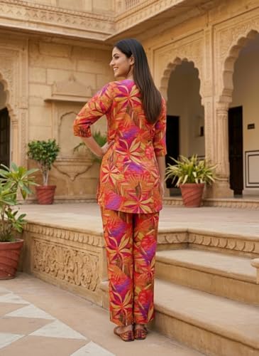 Image of NAINVISH Women's Printed Rayon Blend Co-ord Set | Straight Fit Top & Pant Ensemble | V-Neck Mandarin Collar Styles | Modern Black, Orange, Purple, Green Designs | Perfect for Casual, Festive Events