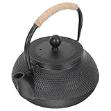 Petite théière en fer forgé à la surface lisse, élégante et raffinée