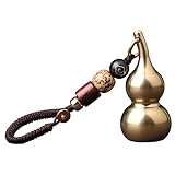 Kürbis-ornament: der kürbis-anhänger ist nicht nur ein schlüsselanhänger, sondern auch ein anhänger für den autorückspiegel, ein kürbis-ornament aus messing.