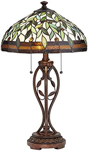 Close-up of the intricately hand-cut glass and faux jewel details on a traditional Tiffany style lamp shade.